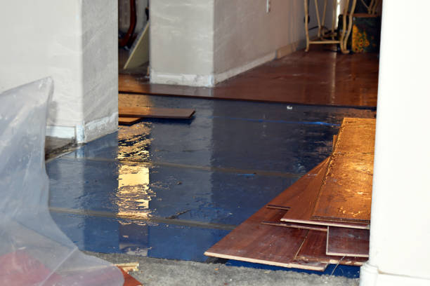 Professional Flood Damage Restoration technician working in Spencer, MA